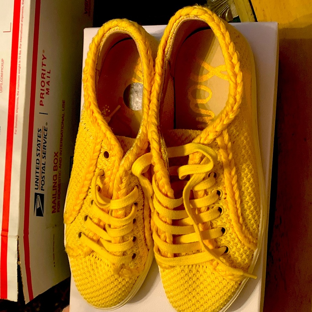 yellow lace up tennis shoes.  Size 7